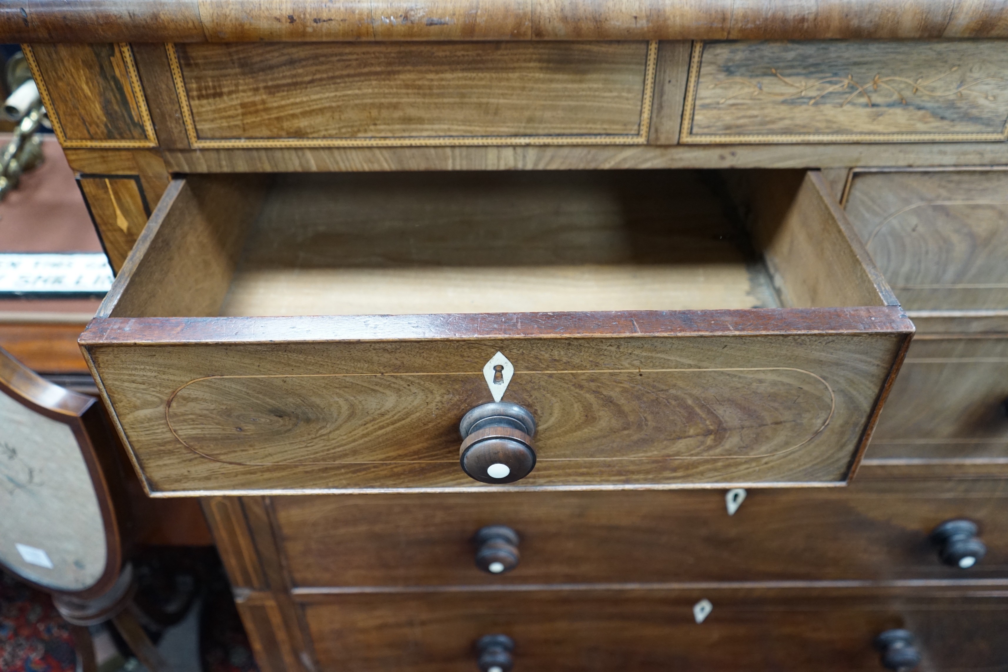 A George IV inlaid mahogany chest of eight drawers, width 122cm, depth 53cm, height 120cm